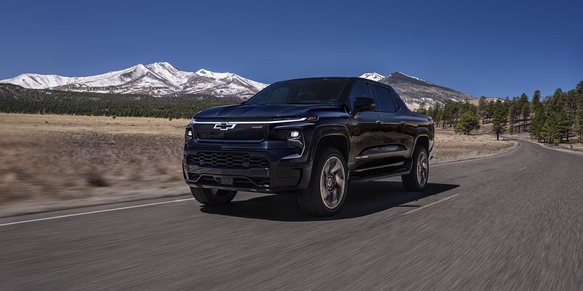 2025 chevrolet silverado ev driving on the road